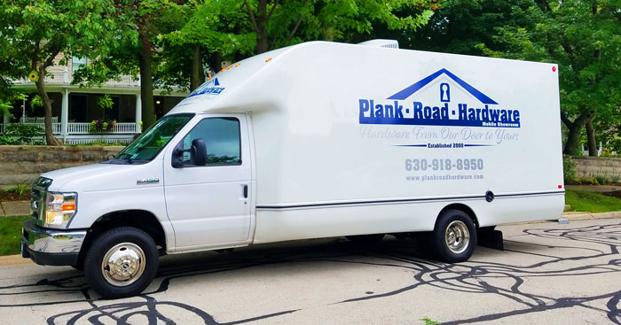 Plank Road Hardware mobile showroom truck parked on a residential street